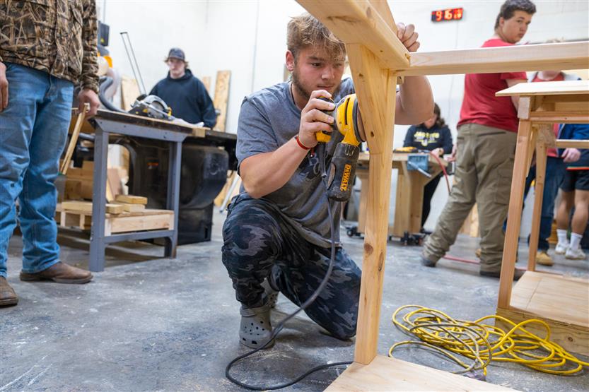 Students build doghouses